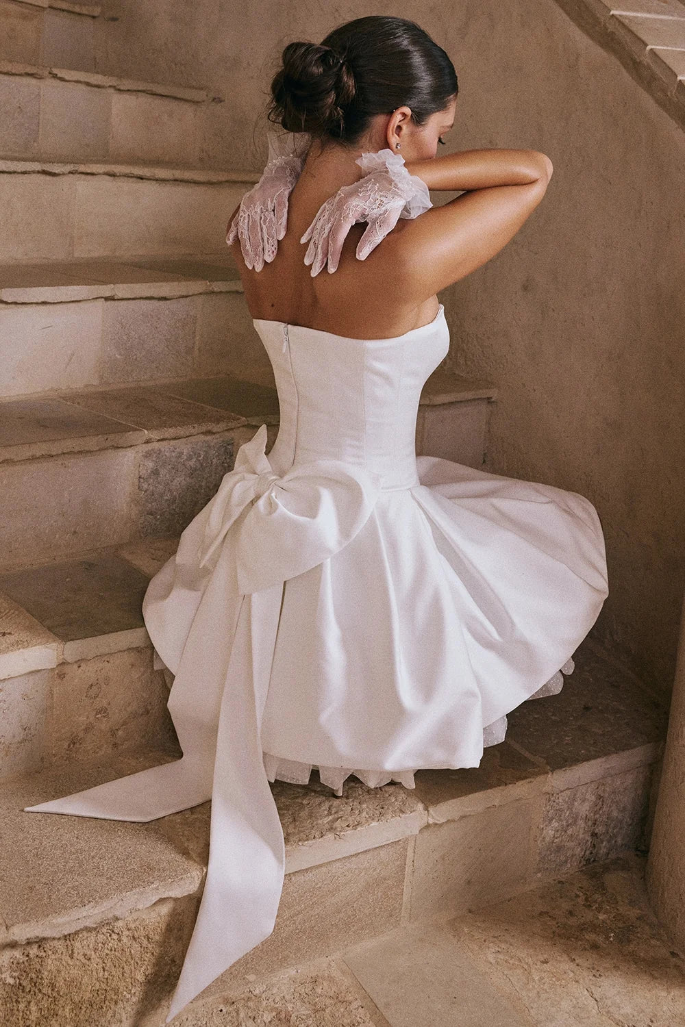 white satin strapless bow mini gown